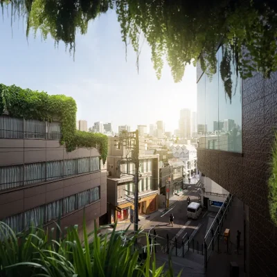 Vista urbana em perspectiva de edifícios modernos com telhados e fachadas cobertos por vegetação e plantas pendentes, simbolizando o conceito de condomínio sustentável e a integração de áreas verdes na gestão predial.